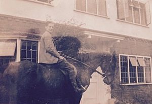 This family photograph is captioned "Alan outside "Friston". 